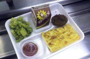 a lunch tray with a selection of healthy food