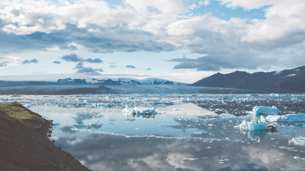 Shoreline landscape with melting ice in the ocean